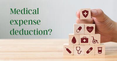 Building blocks with health related icons imprinted on them, next to words "Medical expense deduction?"